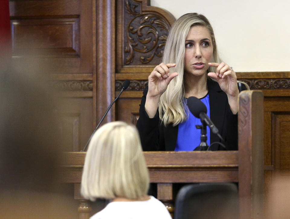 Dr. Kelly Kruse, a forensic pathologist with Iowa State Medical Examiner's office describes injuries she observed during an autopsy of Amy Mullis as she testifies in Todd Mullis' murder trial Wednesday, Sept. 18, 2019, at the Dubuque County Courthouse in Dubuque, Iowa. Authorities say Mullis fatally attacked his wife, 39-year-old Amy Mullis, in November at her farm northwest of Earlville, Iowa. (Dave Kettering/Telegraph Herald via AP)