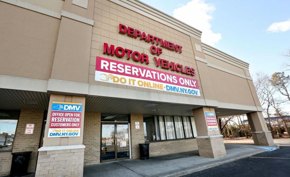 department of motor vehicles exterior in medford, new york with signs to make an appointment