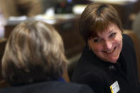 FILE - In this Feb. 19, 2014, file photo, Rep. Mary Throne, D-Cheyenne, right, talks to Rep. Cathy Connolly, D-Laramie, during the afternoon session of the Wyoming Legislature at the state Capitol in Cheyenne, Wyo. The winner in the Republican primary on Tuesday, Aug. 21, 2018, will likely meet Throne, of Cheyenne, in November. Throne faces three little-known opponents in the Democratic primary. (Miranda Grubbs/The Wyoming Tribune Eagle via AP, File)