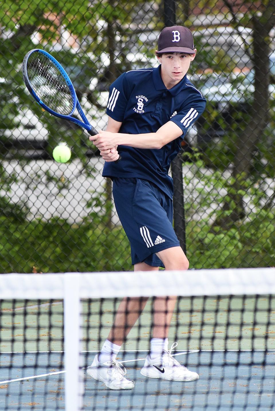 Somerset Berkley second singles player Zachary Costa hits a shot over the net in Thursday's match against Seekonk at Chapman Courts in Somerset.