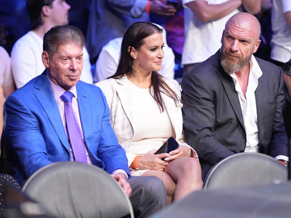 Vince McMahon, pictured here with daughter Stephanie and Triple H at UFC 276 in July.