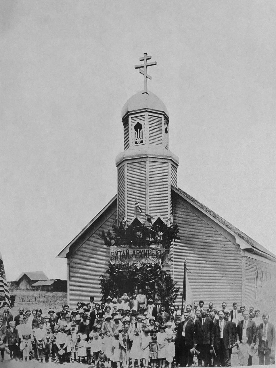 The thriving congregation of St. Mary Ukrainian Orthodox Church is shown in a photograph taken in 1925 during Bishop Ivan Theodorovich's visit to the house of worship that was then located in Harrah, Oklahoma.