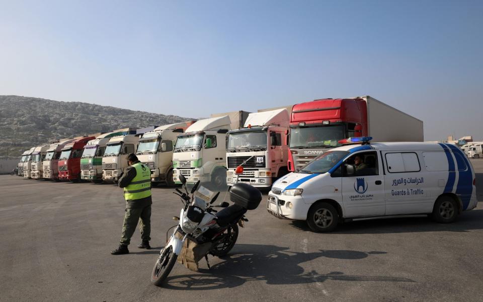 Trucks carrying aid after crossing the Bab al-Hawa border point at the Syrian-Turkish border last month - YAHYA NEMAH/EPA-EFE/Shutterstock