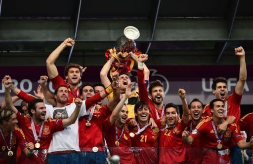 Spain's players celebrate with the trophy after winning the Euro 2012 football championships final against at the Olympic Stadium in Kiev on July 1. Spain beat Italy 4-0 to successfully defend their title