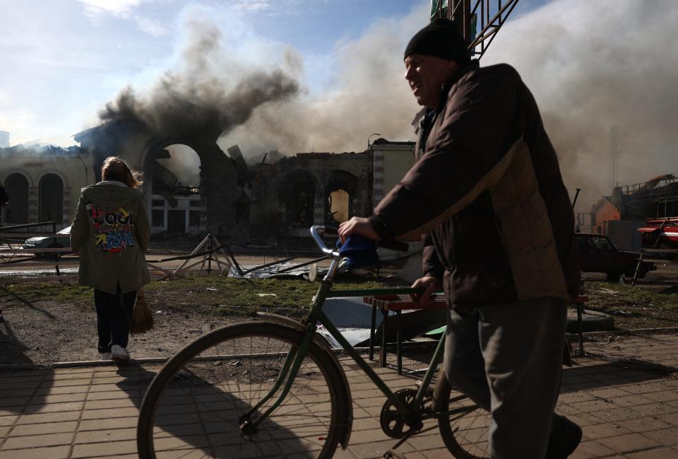 TOPSHOT - Local residents walk past the railway station destroyed by a Russian missile attack in Kostyantynivka, Donetsk region, on February 25, 2024, amid the Russian invasion of Ukraine.