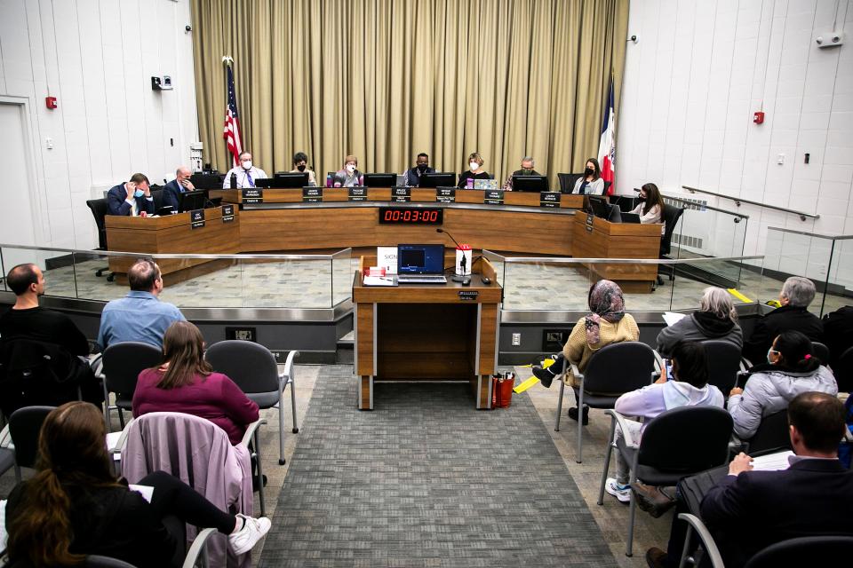 Bruce Teague, mayor of Iowa City, center right, speaks during a council meeting, Tuesday, April 19, 2022, at the Emma J. Harvat Hall inside City Hall in Iowa City, Iowa.