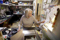 In this Thursday, June 25, 2020, photo, Karen Hayes works in her office in Parnassus Books in Nashville, Tenn. The independent bookstore, owned by Hayes and novelist Ann Patchett, opened and thrived while others were closing their doors and is once again defying the odds during the coronavirus pandemic. (AP Photo/Mark Humphrey)