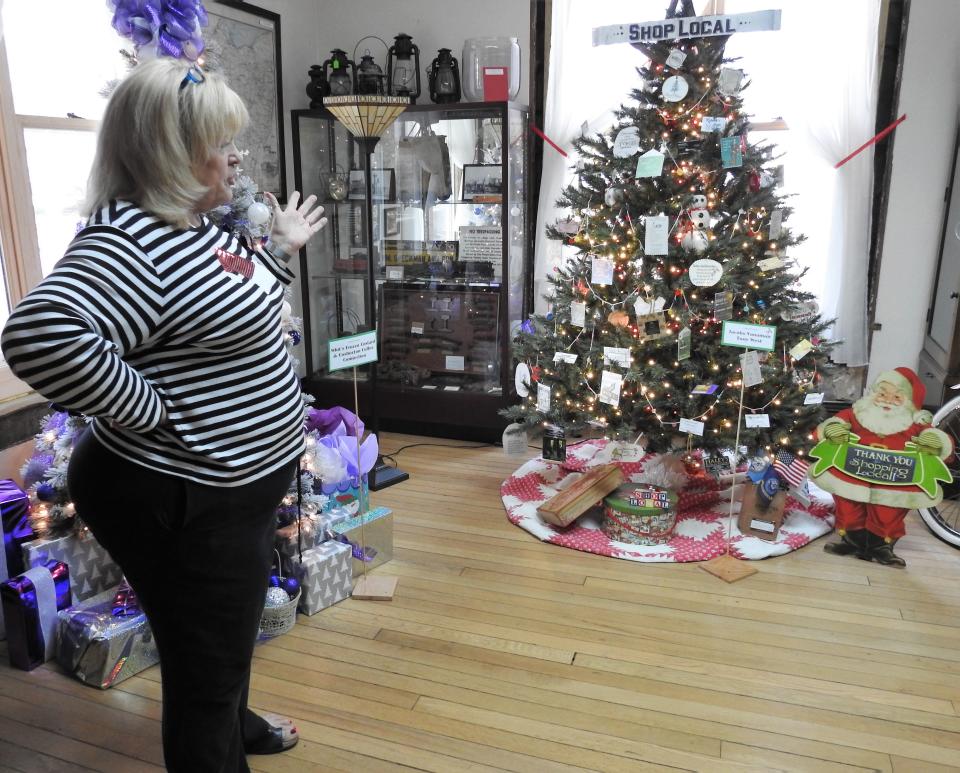 Brenda Davis of the Walhonding Valley Historical Society points out one of her favorite entries in this year's Festival of Trees from Jacobs Vanaman Agency. The theme is shop local.