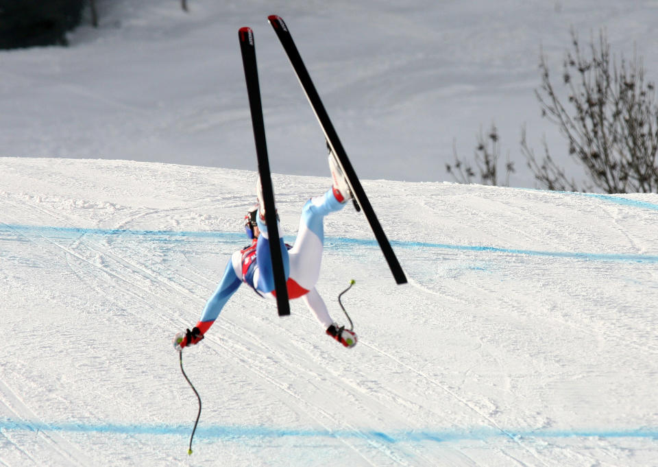 FILE - This is a Thursday, Jan. 22, 2009 file photo of Swiss skier Daniel Albrecht looses control during a downhill training on the legendary Streif downhill course in Kitzbuehel, Austria,. Albrecht injured himself in the crash after he lost control and flew through the air for about 40 meters (yards) coming to a stop near the finish line. He received medical attention for several minutes before being airlifted by helicopter to a local hospital. Albrecht counts himself among the lucky. The Swiss Alpine racer left spectators gasping in horror when he lost control during a training run in January 2009, landing on his back and sliding down the icy slope.Then came three weeks in a medically induced coma and months of struggling for a simple word or phrase. Ultimately, while still in his 20s, the former world champion had to give up competing in the sport that he loved. But, viewing Michael Schumacher’s critical brain injuries through the prism of his own, Albrecht knows his own luck held “when I came back as a nearly normal guy.”(AP Photo/Giovanni Auletta, File)