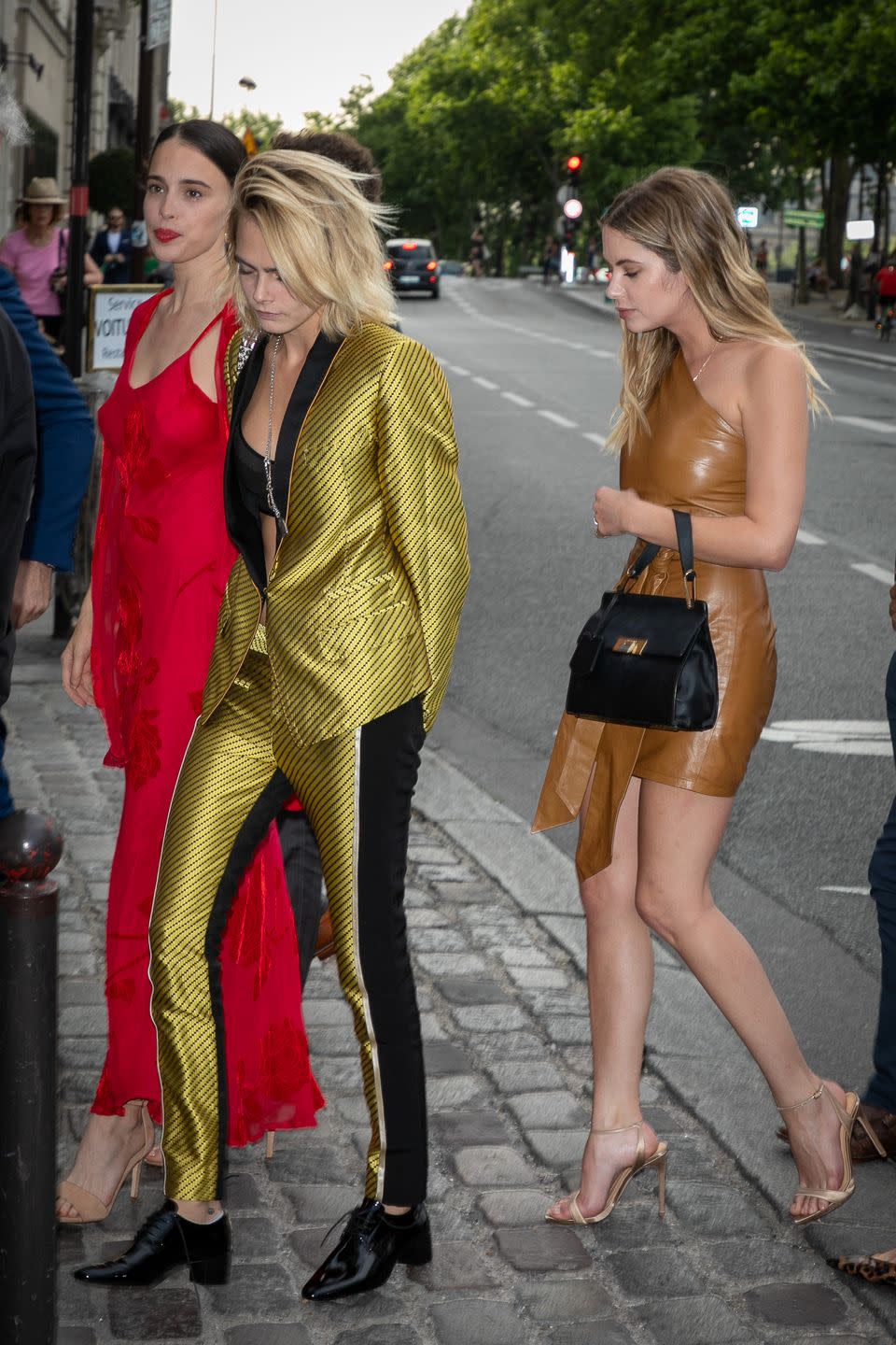 <p>Some of us might panic when we're in the French city of style attending a wedding of someone like Zoë Kravitz. But Cara Delevingne hit the nail on the head in this trim gold tuxedo. We also love Ashley Benson's tan leather mini. </p>