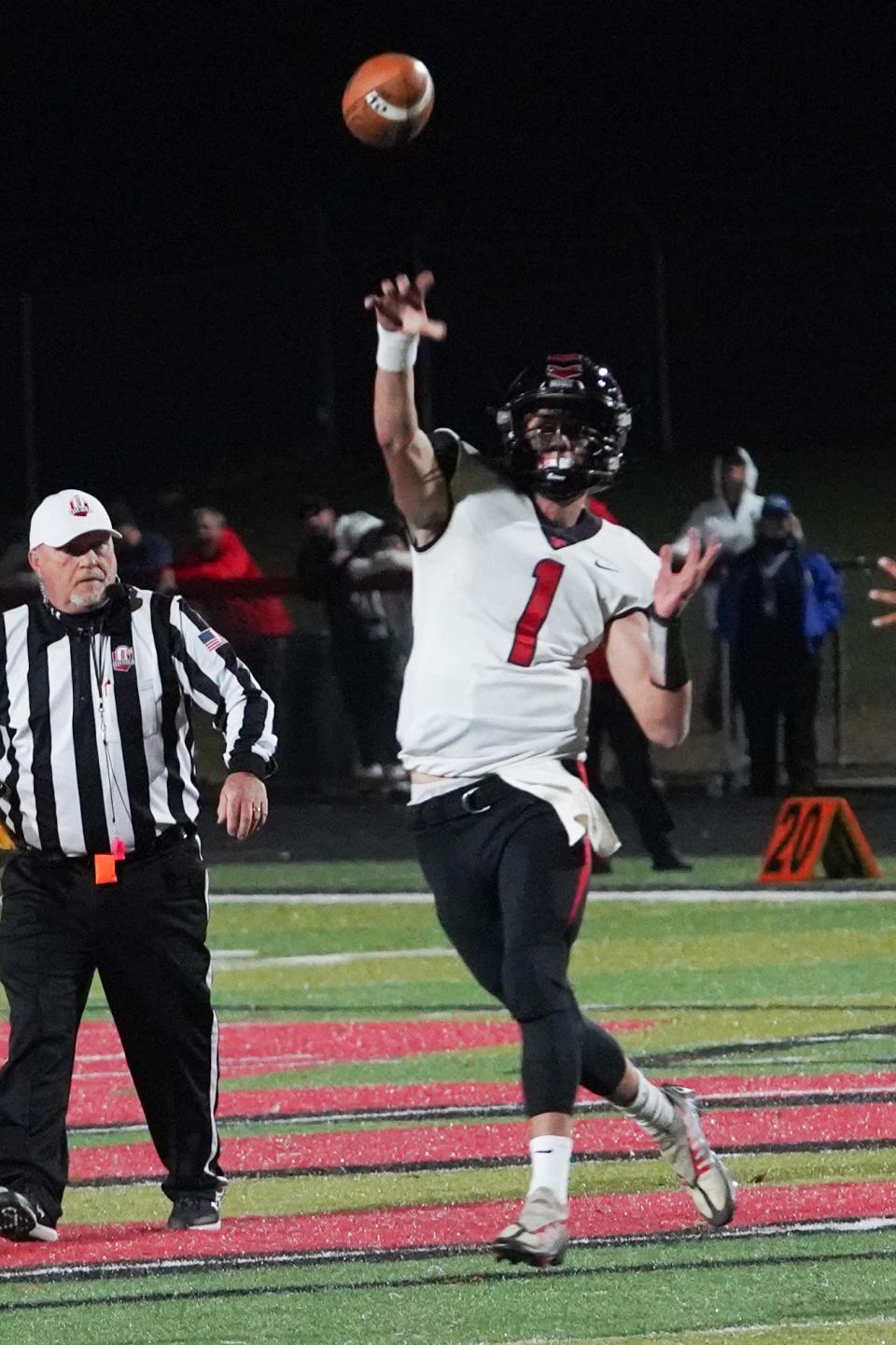 Pleasant quarterback Owen Lowry throws a pass Friday night in a football game at Marion Harding.