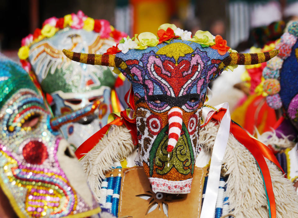 Kukeri from the town of Straldzha don colourful masks (Amos Chapple / Rex Features)