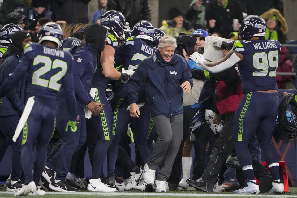 Seattle Seahawks head coach Pete Carroll reacts as players gather during the second half of an NFL football game against the Philadelphia Eagles, Monday, Dec. 18, 2023, in Seattle. The Seahawks won 20-17. (AP Photo/Lindsey Wasson)