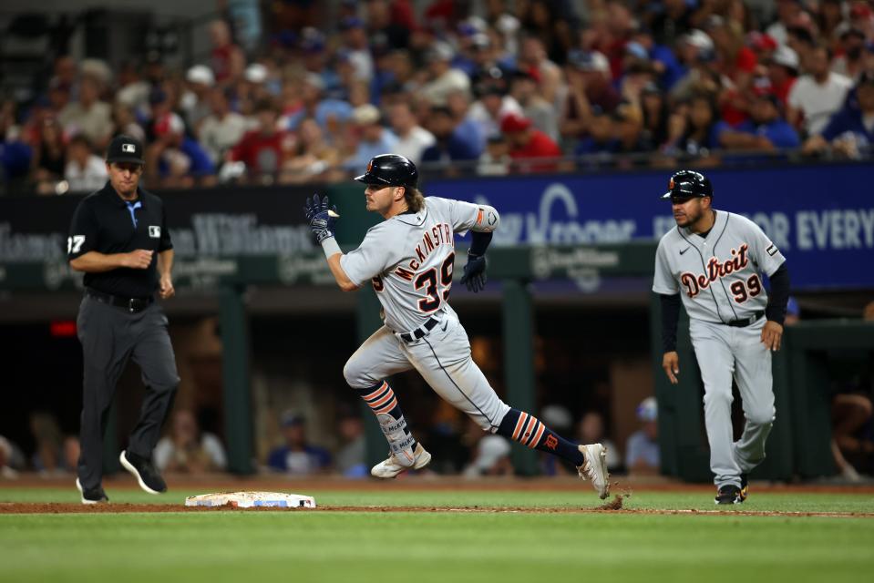 Zach McKinstry #39 of the Detroit Tigers rounds first base on a double in the sixth inning against the Texas Rangers at Globe Life Field on June 28, 2023 in Arlington, Texas.