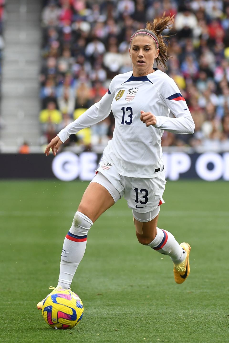 Feb 19, 2023; Nashville, Tennessee, USA; USA forward Alex Morgan (13) chases down a loose ball during the second half against Japan at Geodis Park. Mandatory