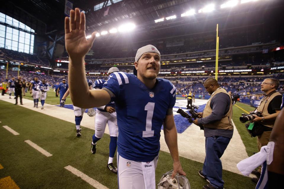 Indianapolis Colts punter Pat McAfee waves to fans as he leaves the field following a 17-10 win over the Houston Texans an NFL football game in Indianapolis, Sunday, Dec. 14, 2014. (AP Photo/Darron Cummings) ORG XMIT: NAS128