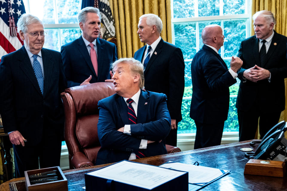 WASHINGTON, DC - MARCH 27: U.S. President Donald Trump speaks with Senate Majority Leader Mitch McConnell (R-KY) during a bill signing ceremony for H.R. 748, the CARES Act in the Oval Office of the White House on March 27, 2020 in Washington, DC. Earlier on Friday, the U.S. House of Representatives approved the $2 trillion stimulus bill that lawmakers hope will battle the the economic effects of the COVID-19 pandemic. (Photo by Erin Schaff-Pool/Getty Images)