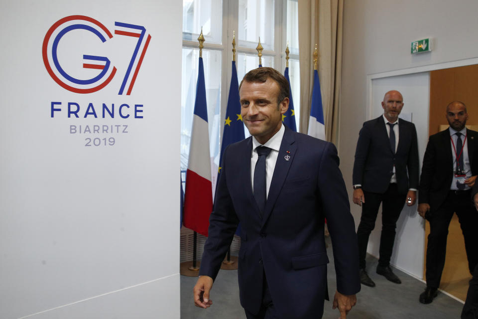 French President Emmanuel Macron arrives for his final press conference at the G7 summit Monday, Aug. 26, 2019 in Biarritz, southwestern France. (AP Photo/Francois Mori)