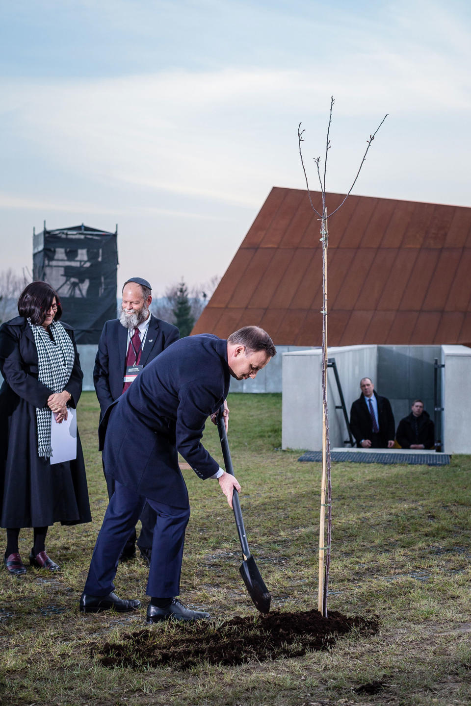 Polish President Andrzej Duda is seen planting a tree before the opening ceremony of The Ulma Family Museum Of Poles Saving Jews in World War II.<span class="copyright">Wojtek Radwanski—AFP/Getty Images</span>