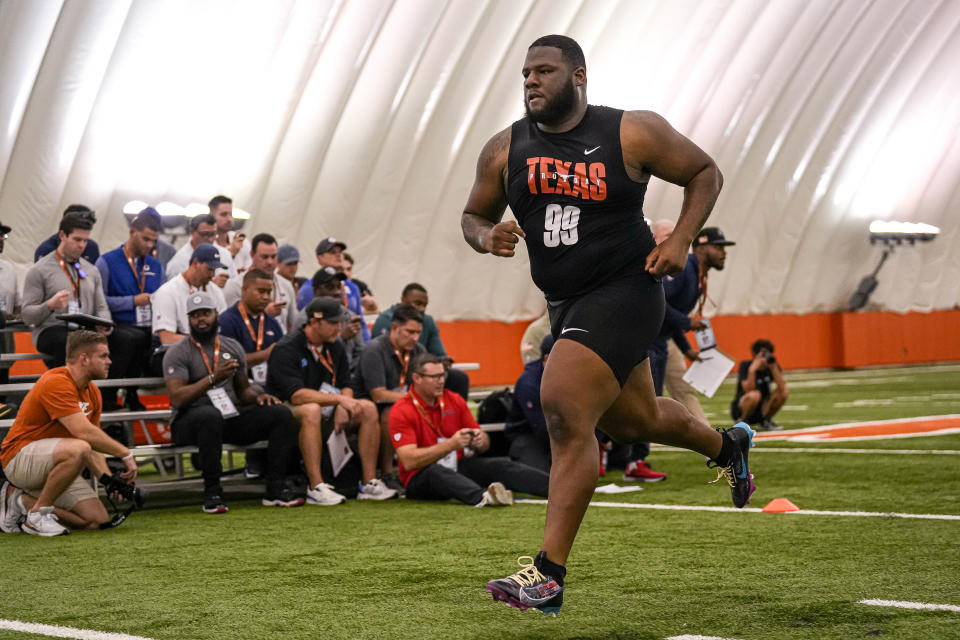 Defensive lineman Keondre Coburn (99) competes in the 3-cone drill at the Texas Longhorns’ annual pro timing day at Denius Fields on the Universiy of Texas at Austin Campus on Thursday March 9, 2023.<br>© Aaron E. Martinez / Austin American-Statesman