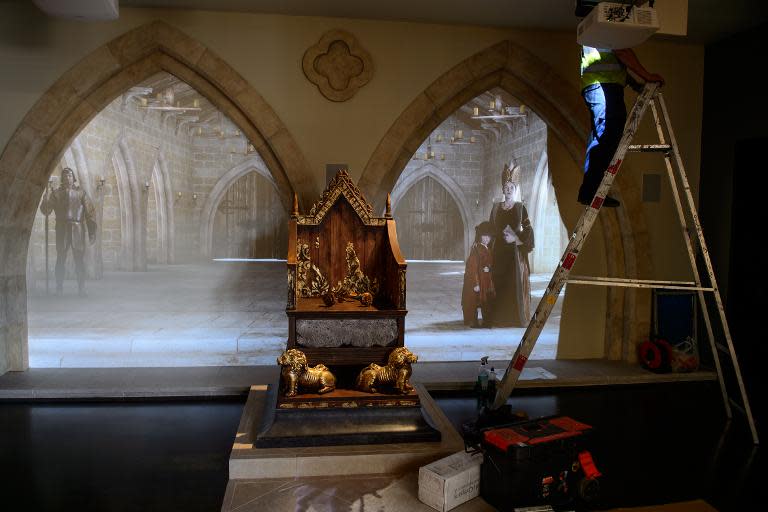 A workman completes an installation in the new Richard III visitor centre in Leicester, central England, on July 24, 2014