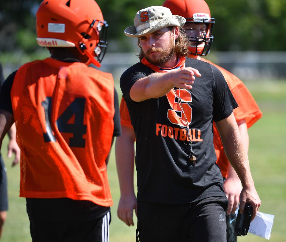 Sarasota High football coach Brody Wiseman gives instruction during a practice session during the 2022 season. Sarasota High parted ways with Wiseman on Thursday.