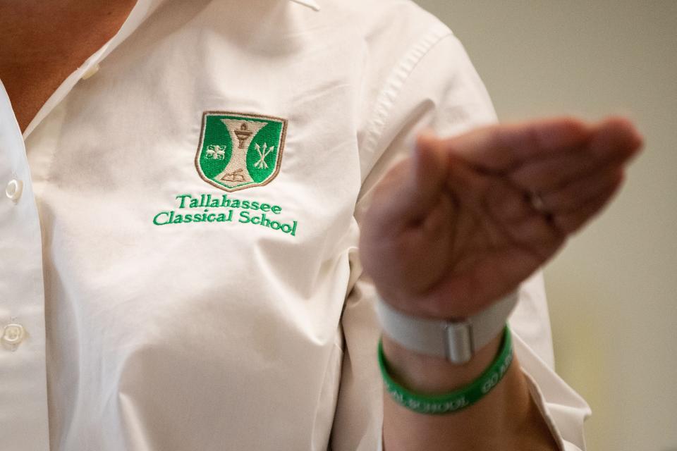 A Tallahassee Classical School teacher speaks to the board of directors during public comment Monday, March 27, 2023. 