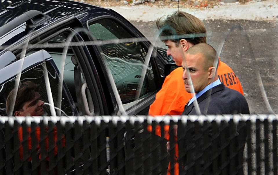 Wearing an orange Sheriff's Department jumpsuit, Neil Entwistle is taken from Middlesex Superior Court in June 2008 to begin his life sentence. Entwistle was found guilty of murdering his wife, Rachel, and their 9-month-old daughter, Lillian, in January 2006.