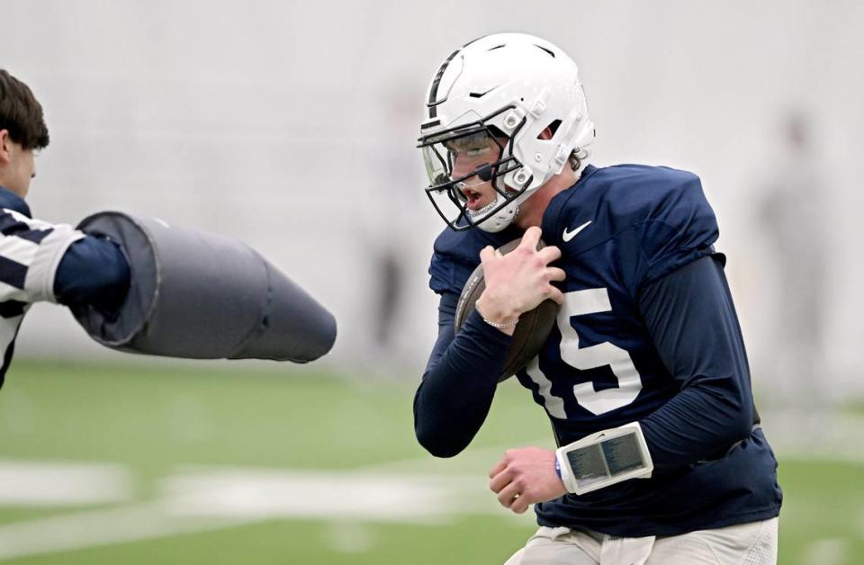 Penn State quarterback Drew Allar runs a drill during practice on Tuesday, April 2, 2024.