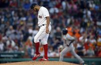 Boston Red Sox's Eduardo Rodriguez stands on the mound after giving up a solo home run to Houston Astros' Martin Maldonado, right, during the fourth inning of a baseball game in Boston, Saturday, Sept. 8, 2018. (AP Photo/Michael Dwyer)