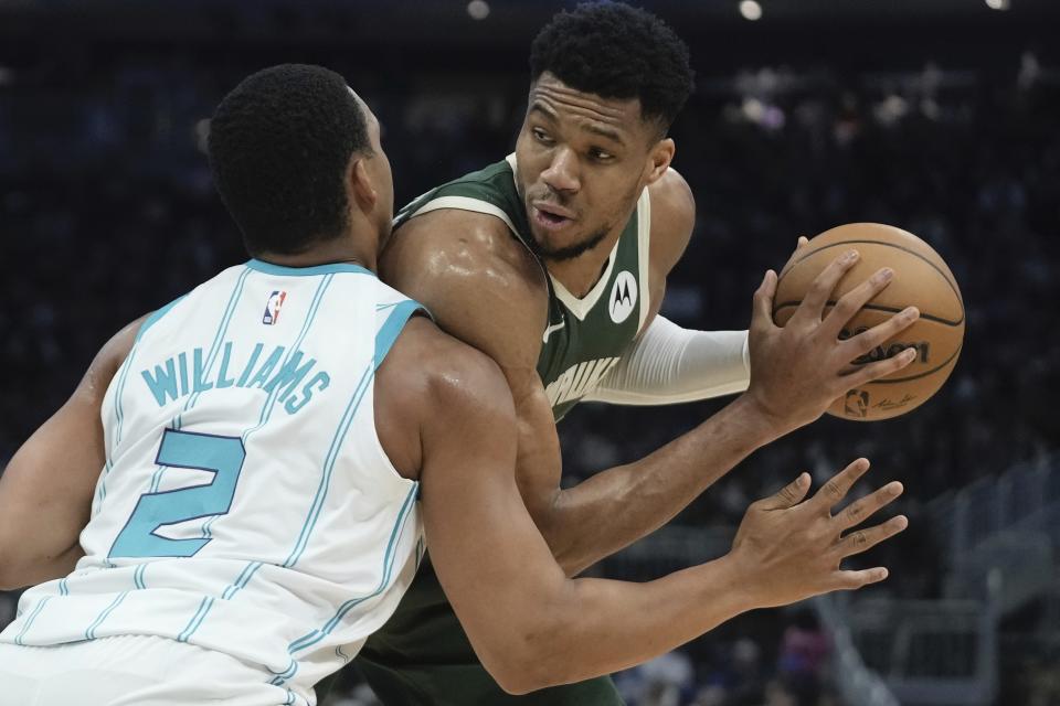 Milwaukee Bucks' Giannis Antetokounmpo tries to get past Charlotte Hornets' Grant Williams during the first half of an NBA basketball game Tuesday, Feb. 27, 2024, in Milwaukee. (AP Photo/Morry Gash)