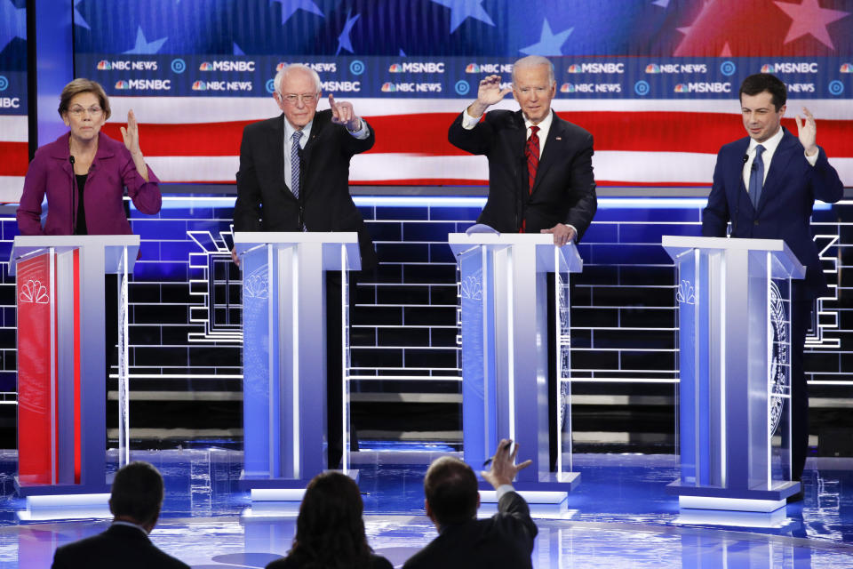 From left, Democratic presidential candidates, former New York City Mayor Michael Bloomberg, Sen. Elizabeth Warren, D-Mass., Sen. Bernie Sanders, I-Vt., former Vice President Joe Biden, former South Bend Mayor Pete Buttigieg, try to answer a question during a Democratic presidential primary debate Wednesday, Feb. 19, 2020, in Las Vegas, hosted by NBC News and MSNBC. (AP Photo/John Locher)