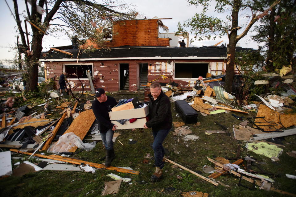 <p>People collect personal effects from damaged homes following a tornado in Dunrobin, Ontario west of Ottawa on Friday, Sept. 21, 2018. A tornado damaged cars in Gatineau, Que., and houses in a community west of Ottawa on Friday afternoon as much of southern Ontario saw severe thunderstorms and high wind gusts, Environment Canada said. (Photo from Sean Kilpatrick/The Canadian Press) </p>