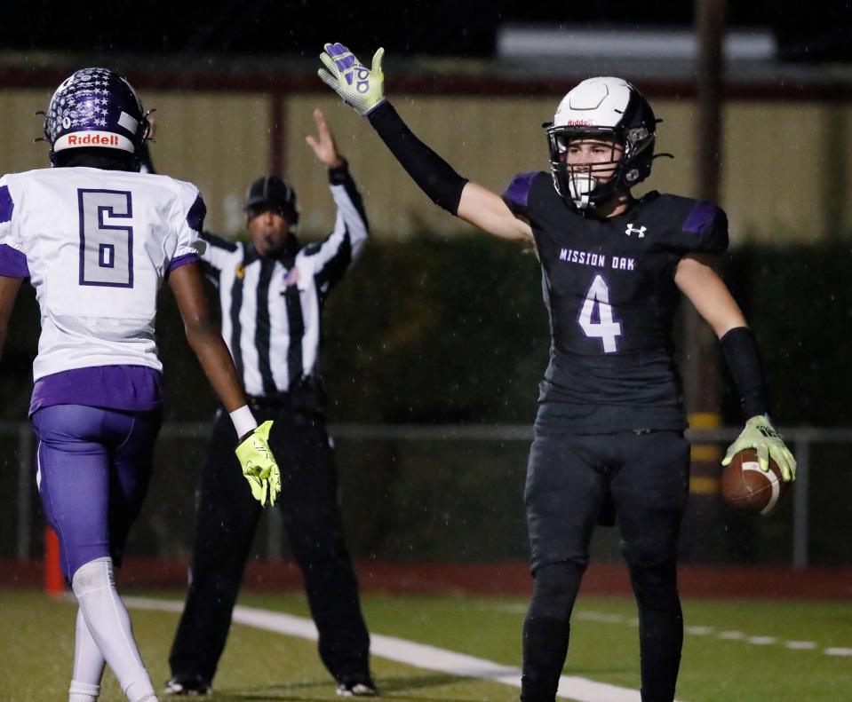 Mission Oak's Cameron Azevedo celebrates a touchdown against Washington Union during their Central Section Division III high school football semifinal playoff game in Tulare, Calif., Friday, Nov. 17, 2023.