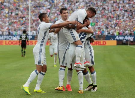 Football Soccer - Real Madrid v Chelsea - International Champions Cup - Michigan Stadium, Ann Arbor, United States of America - 30/7/16 Marcelo celebrates with team mates after scoring a goal for Real Madrid Action Images via Reuters / Rebecca Cook Livepic