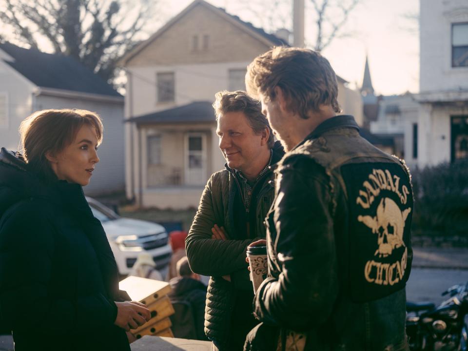 "I’m really fascinated by this pattern that, for lots of reasons, there are people who feel like they don’t belong in mainstream society, so they move to the outer edges of it," said filmmaker Jeff Nichols (center), whose latest, "The Bikeriders," stars Jodie Comer (left) and Austin Butler (right).