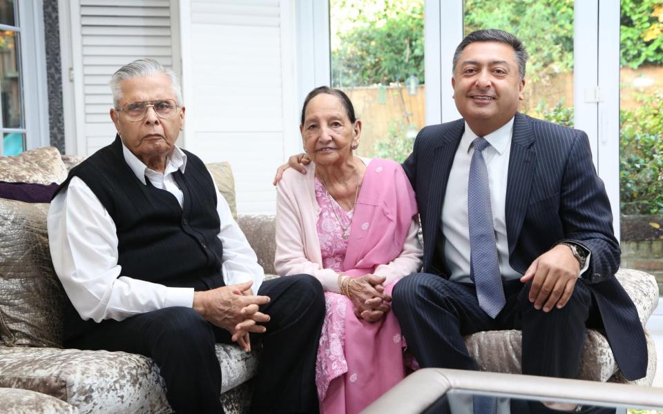 Vik Vedi (R), who is a surgeon, photographed at his home in Gerrards Cross with his father Surinder and mother Yash - Credit: John Lawrence