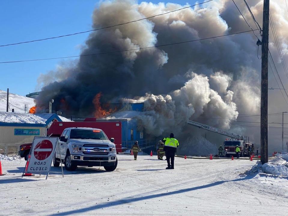 Smoke and flames can be seen at Building 157 in Iqaluit on the morning of Tuesday, March 26, 2024. 