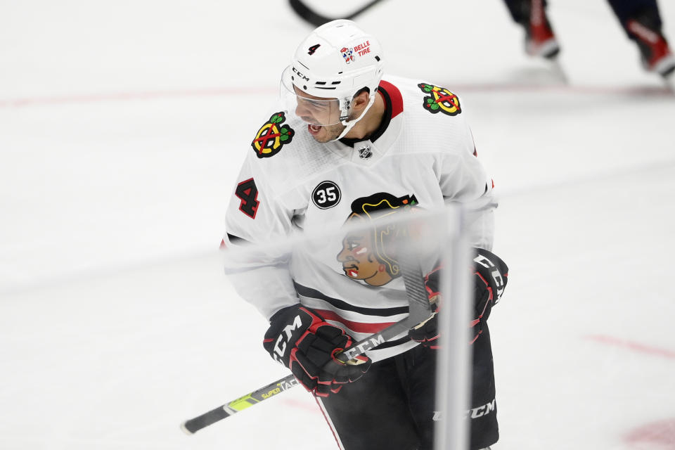 Chicago Blackhawks defenseman Seth Jones (4) celebrates his goal during the third period of an NHL hockey game against the Washington Capitals, Thursday, Dec. 2, 2021, in Washington. (AP Photo/Nick Wass)