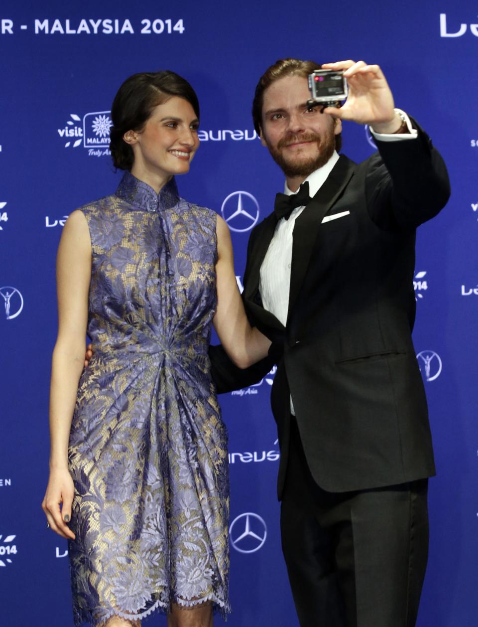 Actor Daniel Bruhl and his girlfriend, model Felicitas Rombold, arrive for the Laureus Sports Awards in Kuala Lumpur March 26, 2014. REUTERS/Samsul Said (MALAYSIA - Tags: ENTERTAINMENT SPORT)