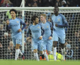 <p>Manchester City’s Leroy Sane, left, celebrates with team mates after scoring during the English Premier League soccer match between Manchester City and Arsenal at the Etihad Stadium in Manchester, England, Sunday, Dec. 18, 2016. (AP Photo/Rui Vieira) </p>