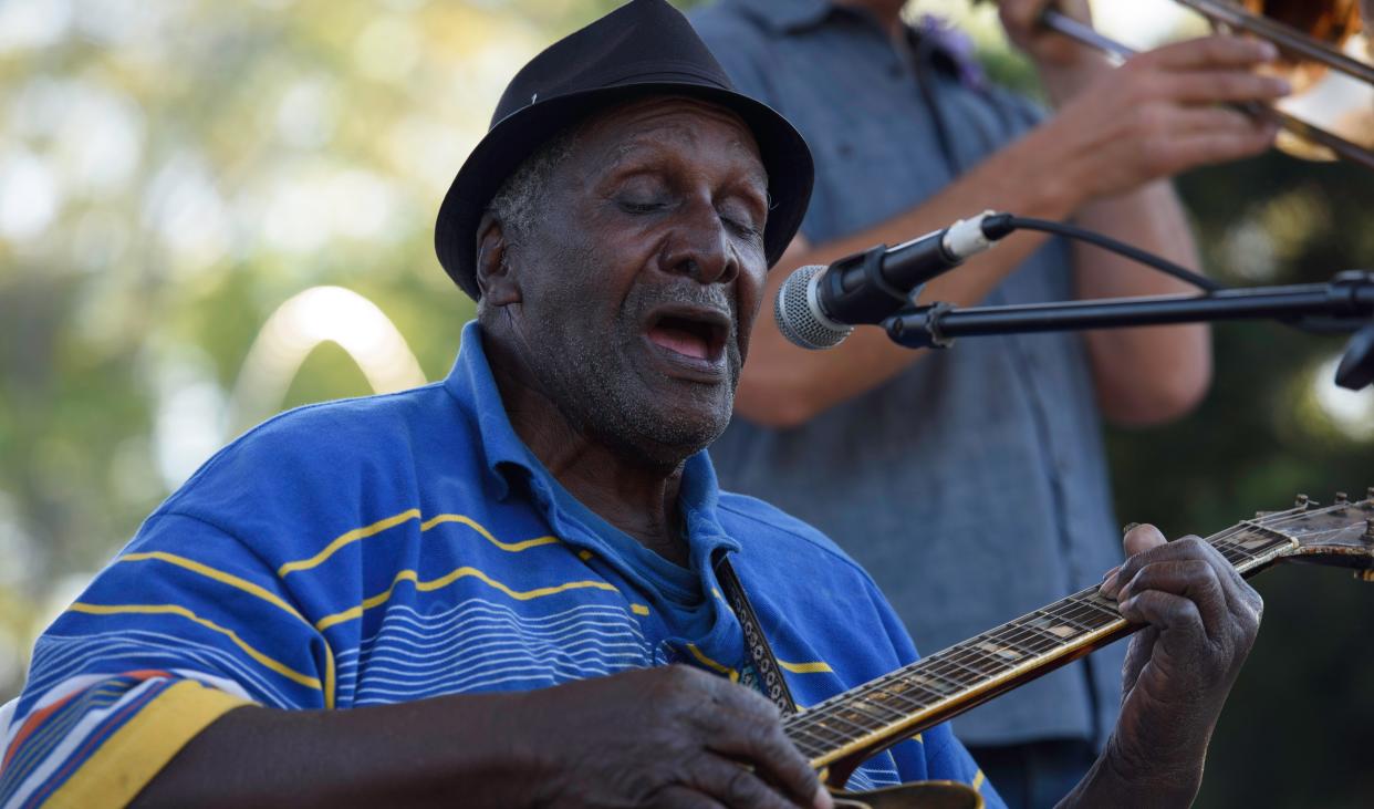 Ellisville blues musician Tommie "T-Bone" Pruitt plays guitar and sings during the Live at Five free outdoor concert series in Town Square Park, Hattiesburg, Miss., Friday, April 1, 2022.
