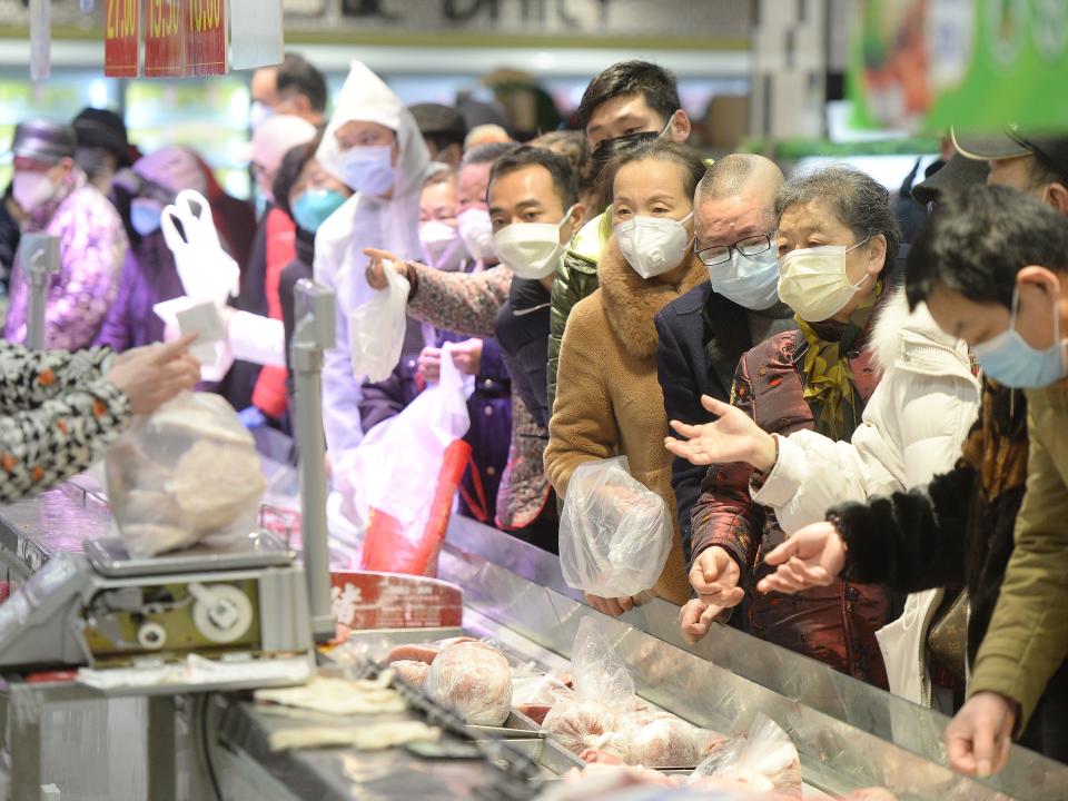 Customers wearing face masks shop inside a supermarket following an outbreak of the novel coronavirus in Wuhan, Hubei province, China February 10, 2020. China Daily via REUTERS  