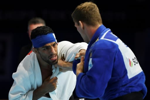 Iran's defending champion Saeid Mollaei throws his -81kg semi-final bout in the 2019 Judo World Championship in Tokyo in August to avoid meeting an Israeli in the final, a move that prompted Iran's judokas to banned for international competition