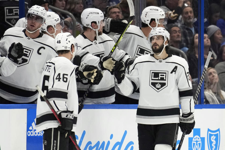 Los Angeles Kings center Phillip Danault, right, celebrates with the bench after his goal against the Tampa Bay Lightning during the second period of an NHL hockey game Saturday, Jan. 28, 2023, in Tampa, Fla. (AP Photo/Chris O'Meara)