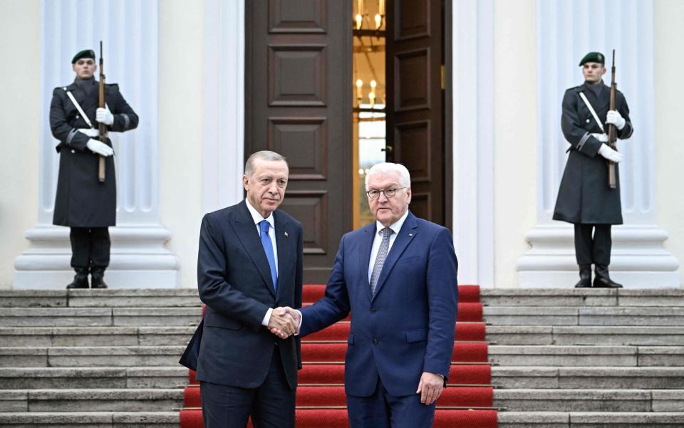 German President Frank-Walter Steinmeier (R) and Turkish President Recep Tayyip Erdogan shake hands upon his arrival at Bellevue presidential palace in Berlin on November 17, 2023. German leaders host Turkey's President Recep Tayyip Erdogan for talks on November 17, 2023, in a highly controversial visit made more explosive by Erdogan's branding of Israel as a "terror state". (Photo by Tobias SCHWARZ / AFP) (Photo by TOBIAS SCHWARZ/AFP via Getty Images)