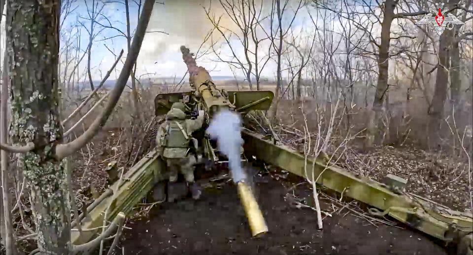 In this handout photo taken from video and released by Russian Defense Ministry Press Service on Wednesday, March 15, 2023, the Russian army's 152-mm howitzer "Hyacinth-B" fires at Ukrainian troops at an undisclosed location. (Russian Defense Ministry Press Service via AP)