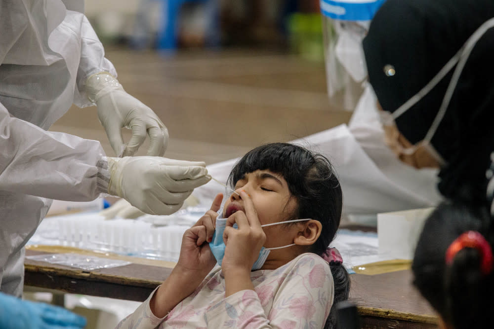 A girl undergoes Covid-19 testing in Ampang May 18, 2021. — Picture by Firdaus Latif