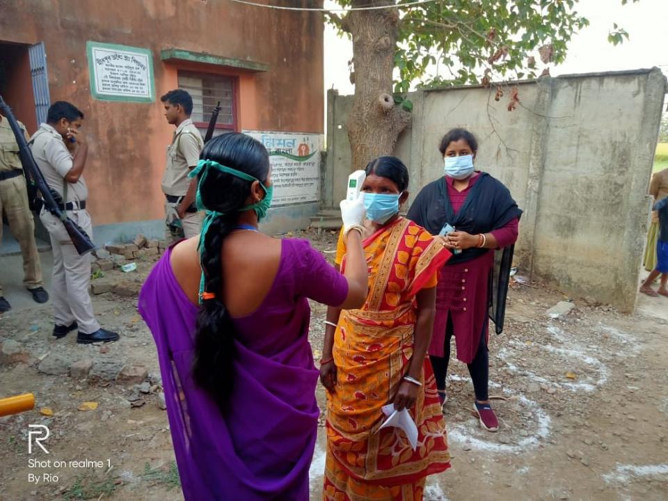 Thermal checking going on at Polling station under 263- Monteswar Assembly Constituency of Purba Bardhaman District.