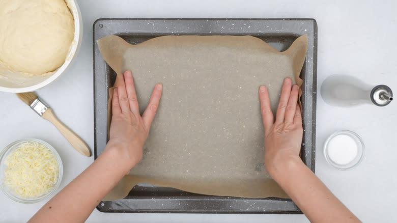 Lining baking pan parchment paper